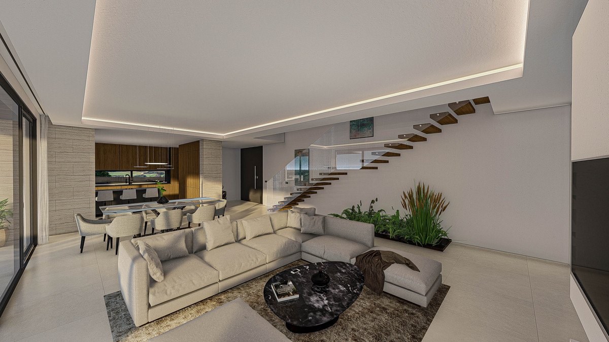 Europa Nova – Mijas - open-plan living room with floating staircase, sectional sofa and dining area