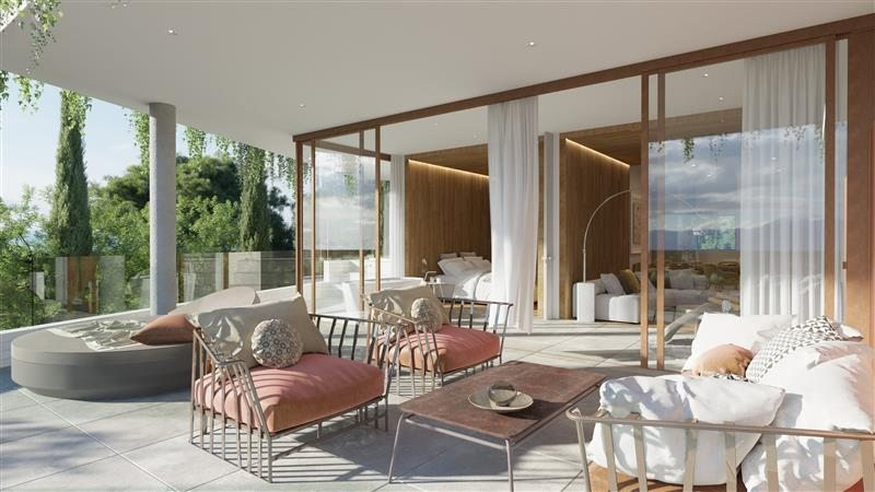 Higueron North Residences – Apartments – Fuengirola - luxury terrace with outdoor lounge seating, glass sliding doors and lush garden views
