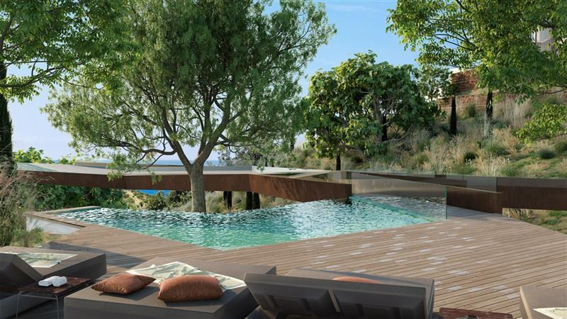 Higueron North Residences – Villas – Fuengirola - private infinity pool on wooden deck surrounded by mature trees with sea views