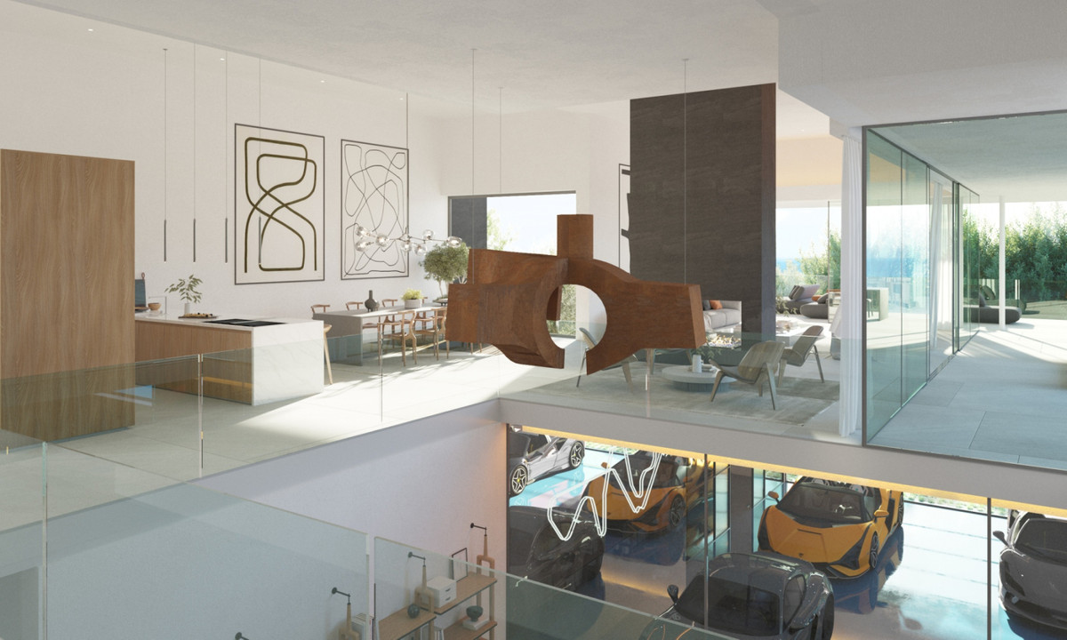The Palm 11 – Benalmadena - open-plan living area with glass-fronted supercar garage below and sculptural art piece