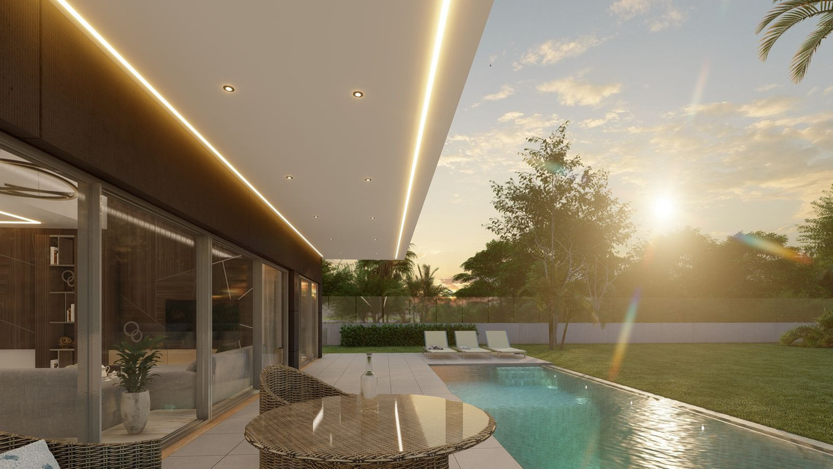 Villa Irıs – Benalmadena - covered terrace with LED lighting, pool, and sunset garden views
