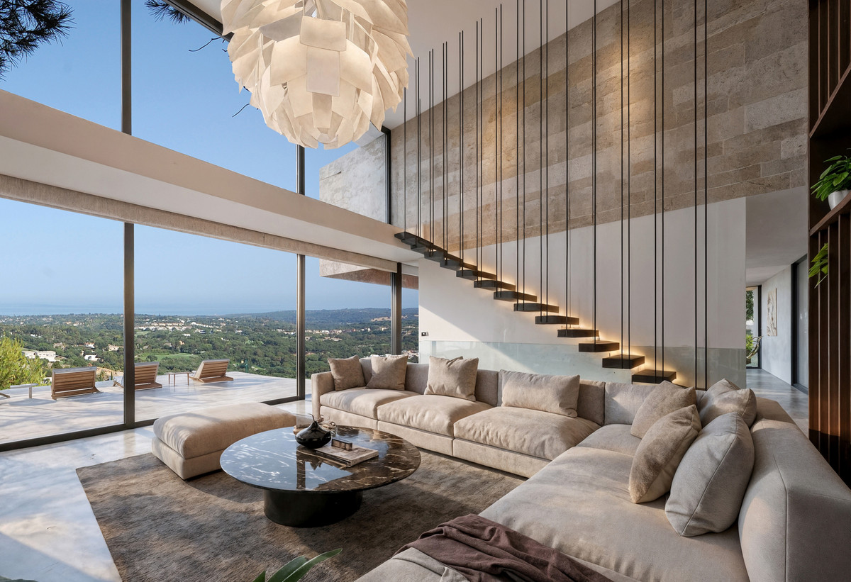 VILLA SIRIO Sotogrande – Sotogrande - double-height living room with floating staircase, panoramic views and statement pendant light