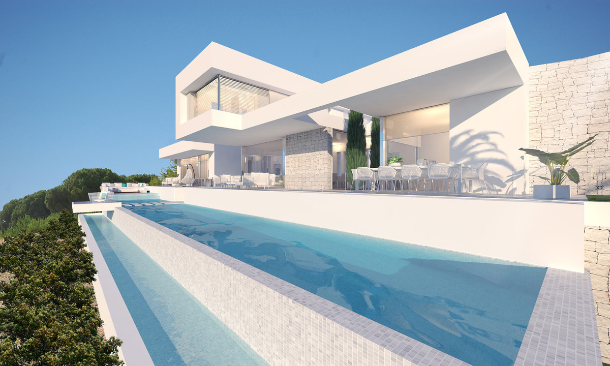 Zoe – Sotogrande - modern white villa exterior with infinity pool, terrace dining area, and panoramic views