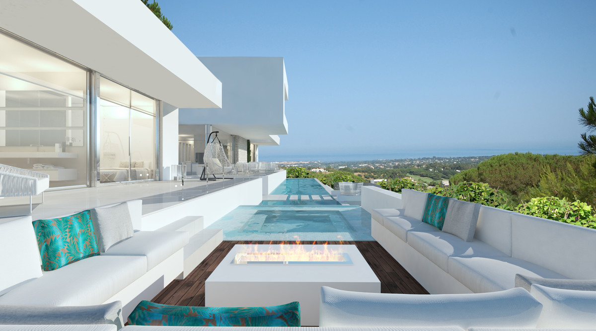 Zoe – Sotogrande - luxury terrace with infinity pool, fire pit, white lounge seating and panoramic sea views