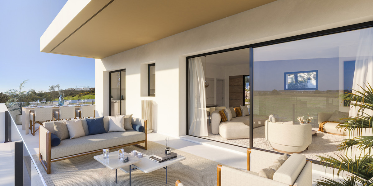 Attire Estepona – Estepona - luxury terrace with outdoor sofas, glass sliding doors and views of the surrounding landscape
