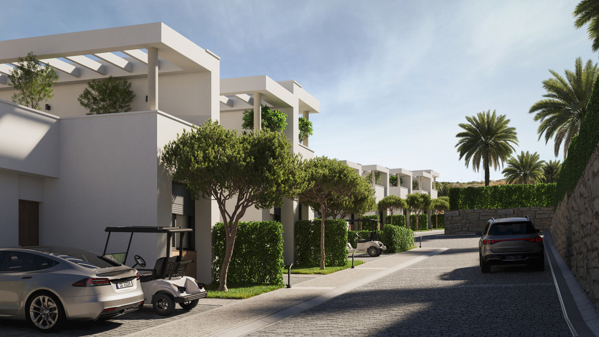 Green Valley – Cerros del Aguila - cobblestone street lined with white modern villas, trimmed hedges, golf cart and parked cars