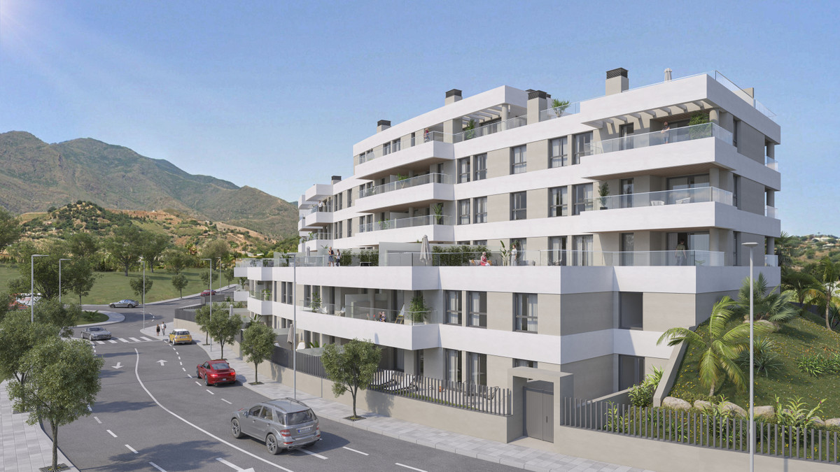Insur Scala – Estepona - modern new-build apartment complex with balconies, mountain backdrop and palm-lined street