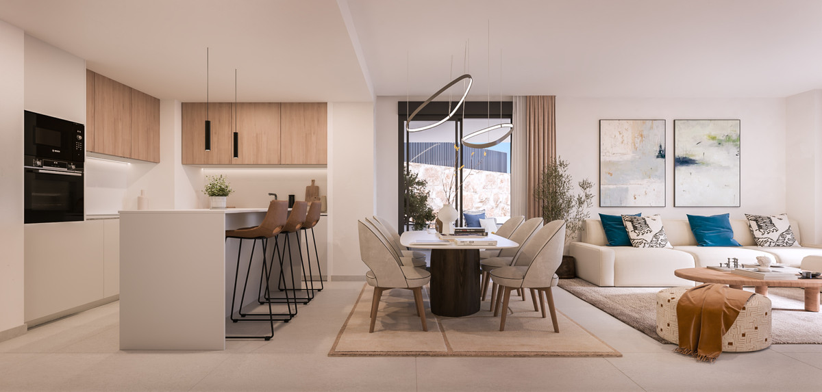 Medblue IV – Altos de los Monteros - open-plan living, dining and kitchen area with warm neutral tones and modern pendant lighting