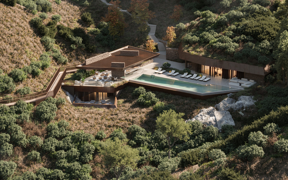 Mosher Collection – Benalmadena - aerial view of hillside luxury villa with infinity pool, sun terraces, and wooden pergola roof surrounded by Mediterranean woodland