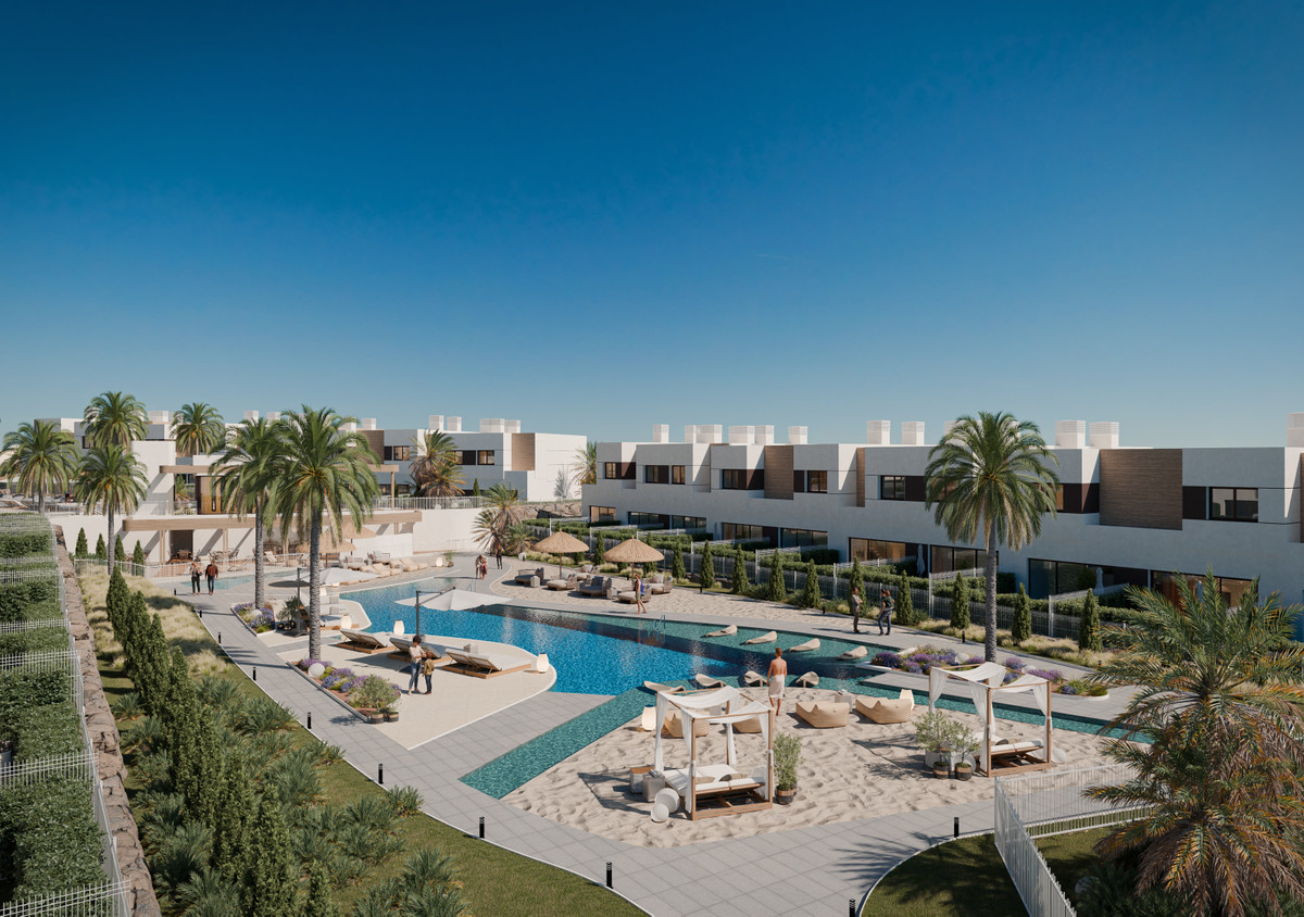 Savia – Fase 2 – Mijas - communal pool with sandy chill-out area, sun loungers, palm trees and white modern townhouses