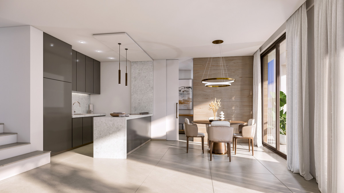 VILLA EVANIA Selwo – Estepona - open-plan kitchen and dining area with marble island, round table and gold ring pendant light