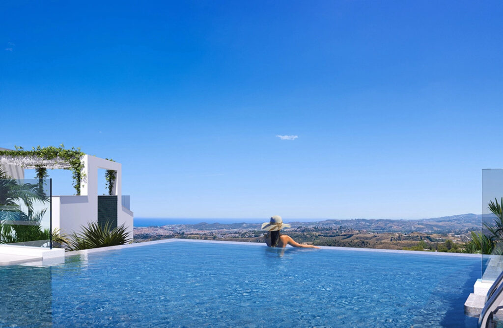 Mijas Seaviews FASE III – Mijas - woman in infinity pool with panoramic sea and valley views under a clear blue sky