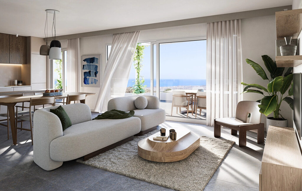Mijas Seaviews FASE III - Mijas - bright open-plan living room with grey sofa, wooden coffee table, and panoramic sea views through floor-to-ceiling glass doors