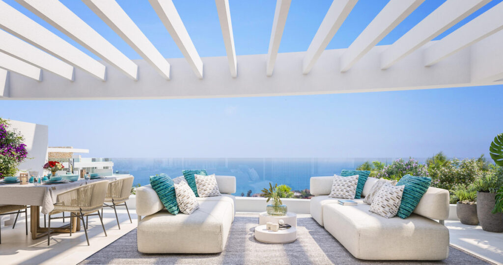 Royal Palms Mijas – FASE IV-1 – La Cala de Mijas - luxury terrace with white pergola, outdoor sofas and panoramic sea views
