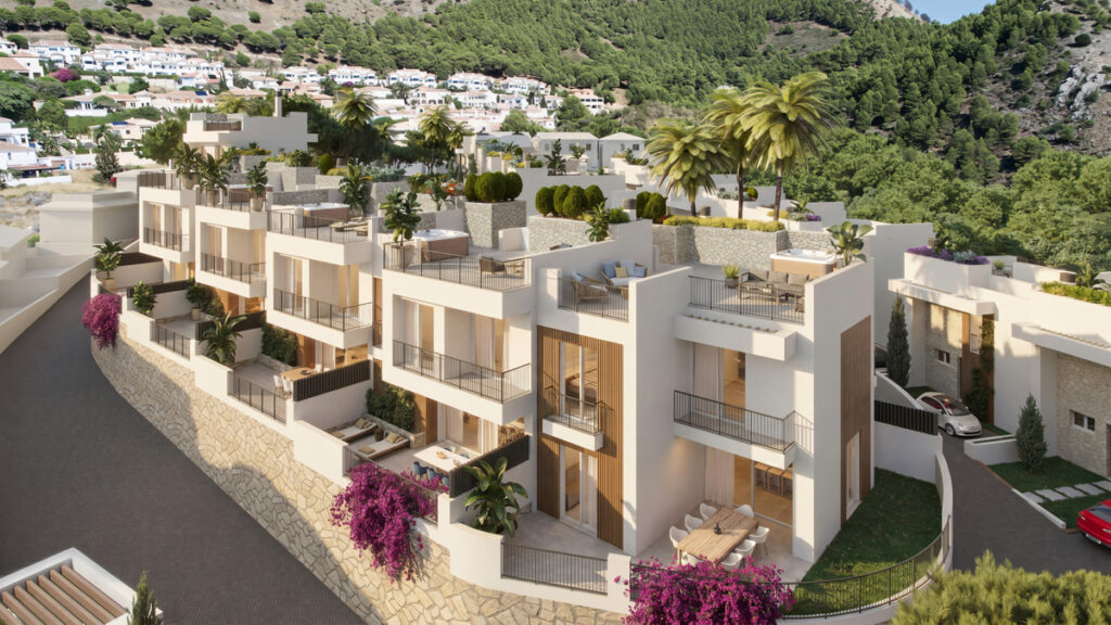 BUENAVISTA VIEWS – Mijas - aerial view of terraced white luxury apartments with rooftop terraces, palm trees and bougainvillea on a hillside
