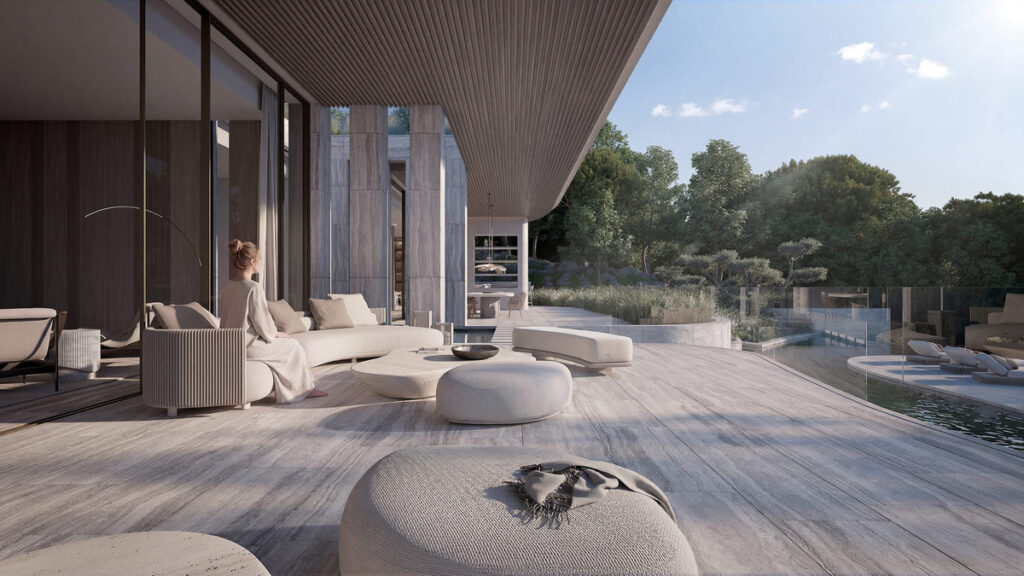 VILLA DUNE – The Fifteen – Sotogrande - shaded outdoor terrace with curved sofas, pool, and lush garden views