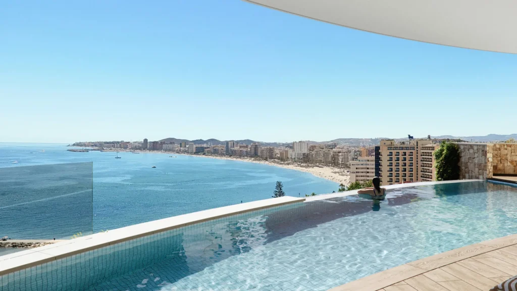 Infinity pool with a view over the bay and beach of Fuengirola on the Costa del Sol, as shown in the Berlingske Boligen interview with Mikael Hansen