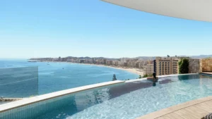 Infinity pool with a view over the bay and beach of Fuengirola on the Costa del Sol, as shown in the Berlingske Boligen interview with Mikael Hansen