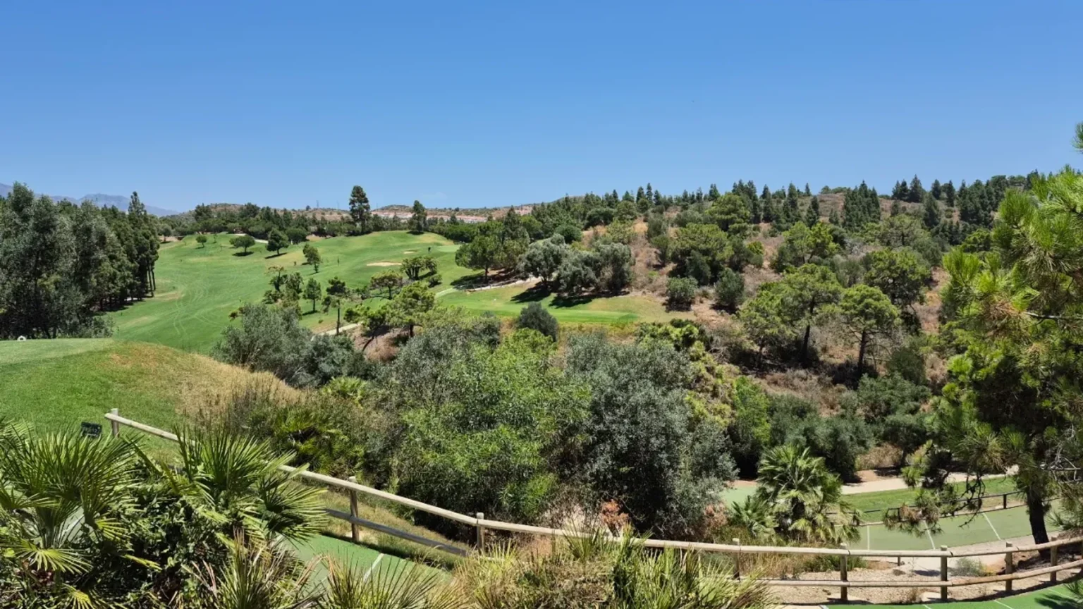 El Chaparral golf course fairways set among pine-covered hills in Mijas Costa