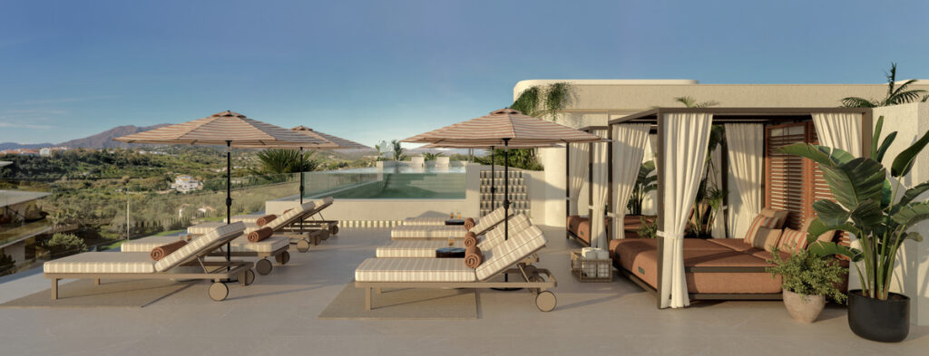 Nacare – Estepona - luxury rooftop terrace with sun loungers, striped umbrellas, cabana daybed and mountain views